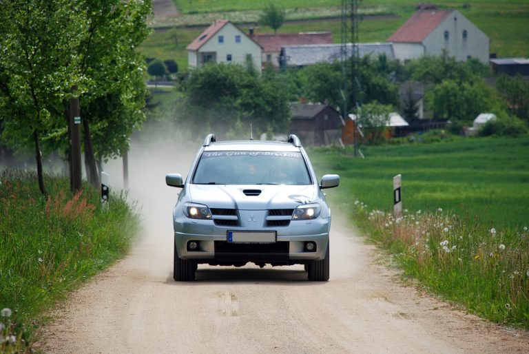 a Mitsubishi Outlander running on Australian dirt road